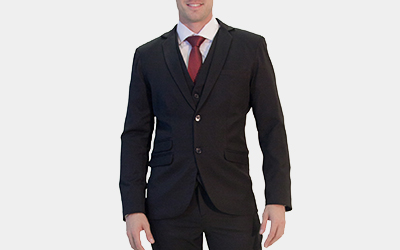 Model wearing men's black suit red tie