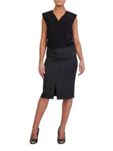 Woman wearing a short black skirt and black shirt