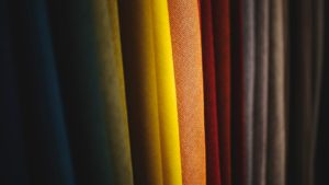 different coloured cloth on a rack