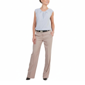 Professional woman in light blue gathered blouse, tan wide-leg trousers, black belt, and black pumps, smiling, hand in pocket.