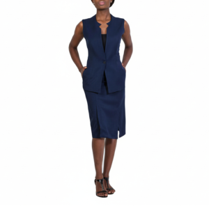 Stylish woman, hands in pockets, wearing navy sleeveless blazer, black top, knee-length pencil skirt, high-heeled sandals.