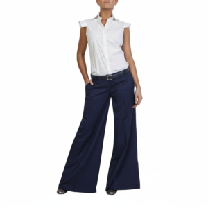 Fashion model in a white sleeveless collared shirt, navy wide-leg trousers, black belt, and metallic silver flats.