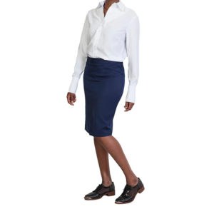 Standing professional in a crisp white button-up shirt, navy pencil skirt, and black sheer-panel oxford shoes.