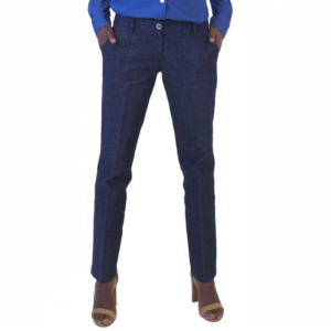 Fashionable person in a blue button-up shirt, navy dress trousers with hands in pockets, and light brown high-heeled sandals.