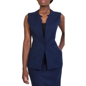 Woman in a navy blue sleeveless blazer with a notched collar, black top, and matching skirt set, hand in pocket.