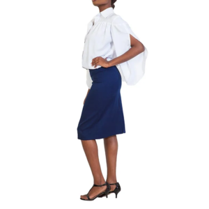 Professional in white cape-sleeve collared shirt, navy blue knee-length pencil skirt, and black heels, standing profile.