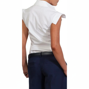 Person from behind wearing a crisp white collared shirt with flared cap sleeves, dark blue trousers, and a black belt.