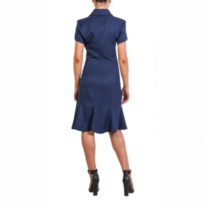 Woman in a navy blue short-sleeved shirt dress with a flared A-line skirt and black high heels, seen from behind.
