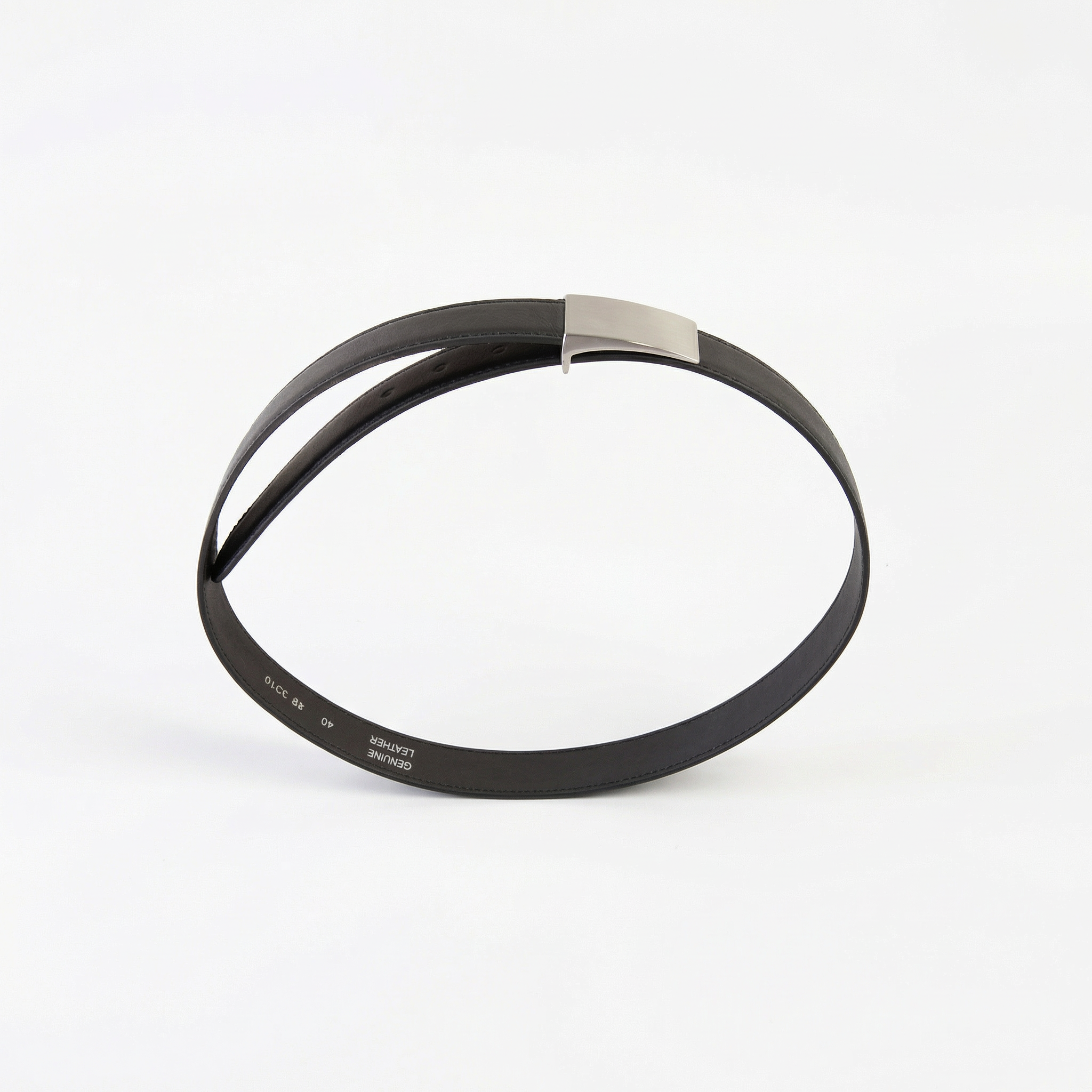 Black leather belt with a polished silver rectangular buckle, curved into an oval and standing upright.