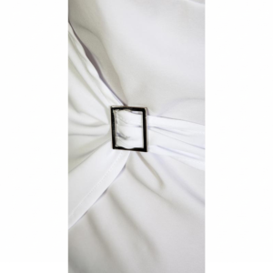 Soft white fabric, elegantly gathered around a polished silver rectangular buckle.