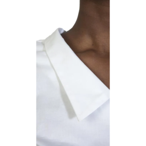 Close-up of a person wearing a Raven Shirt 30 white collared shirt, showing part of their neck, collarbone, and shoulder against a plain white background.