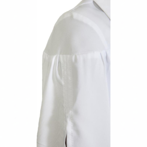 White gathered shirt sleeve with a prominent shoulder seam and intricate vertical stitching.