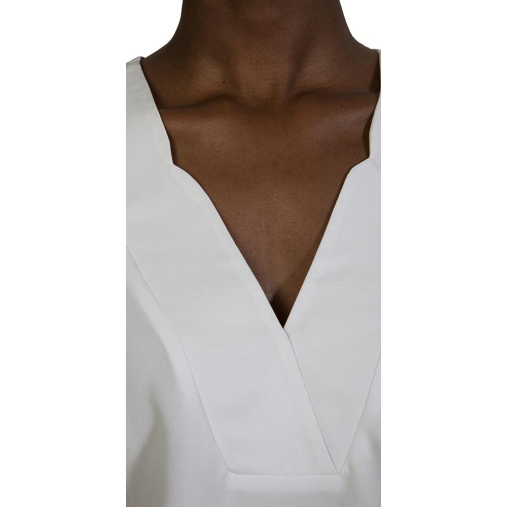Elegant white Zaniah camisole with V-neck design, perfect for stylish casual or dressy wear. Made from high-quality fabric, offering comfort and a sleek look.