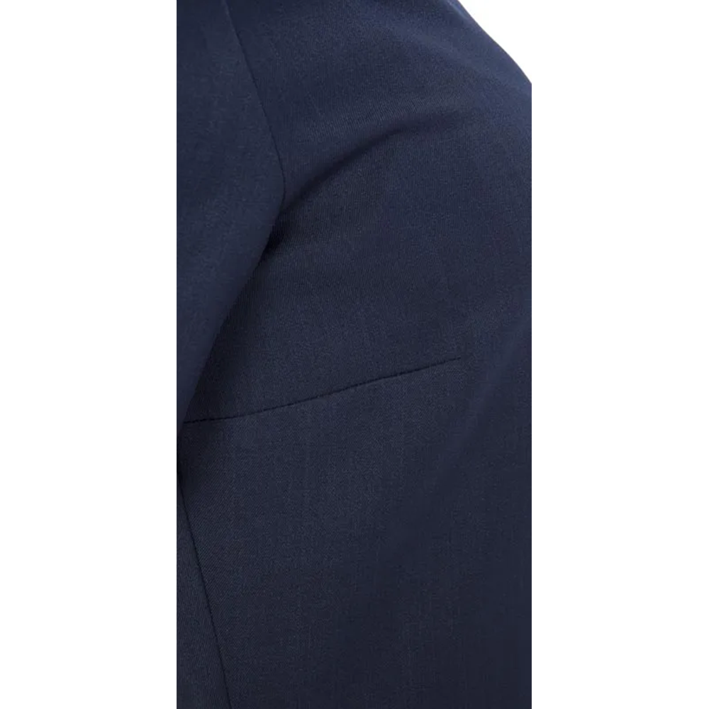 Tailored dark blue suit jacket shoulder and upper back, with a prominent horizontal seam.