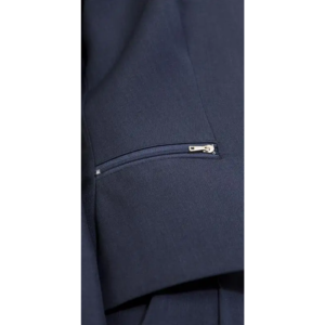 Close-up of textured deep blue fabric with a partially open horizontal zipper and a silver pull tab.