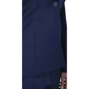 Person in a navy blue single-button blazer and matching trousers, side profile.