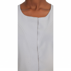 Light grey top featuring a rounded square neckline and prominent curved front seams, worn on a person's upper body.
