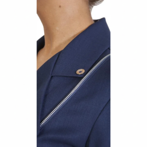 Navy blue jacket on a person's shoulder, featuring a diagonal silver zipper and a small gold button.