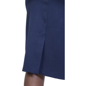 Close-up of a dark blue kick pleat skirt, hemmed above a visible leg.